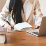 Woman Writing on notebook