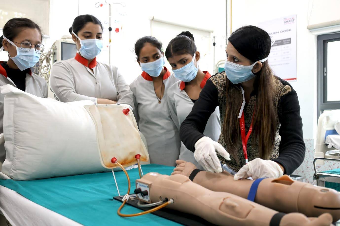 Students of Tech Mahindra SMART Academy for Healthcare interacting with the faculty and getting practical training.